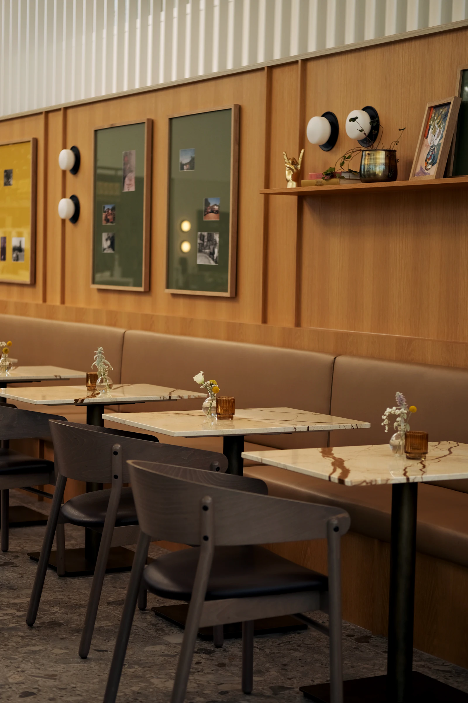 Warm modern restaurant atmosphere with wood paneling